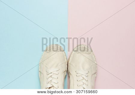 Beige Fashionable Women's Espadrilles On Color Pastel Blue Pink Background. Creative Concept Of Spri