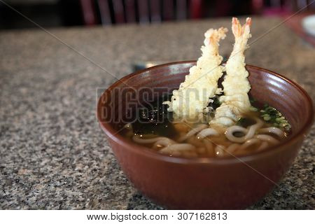 Udon Noodles With Shrimp Tempura On A Bowl