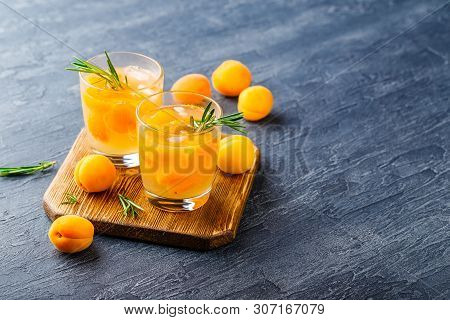 Summer Drinks, Rosemary Aprcot Cocktails With Ice In Glasses. Refreshing Summer Homemade Alcoholic O