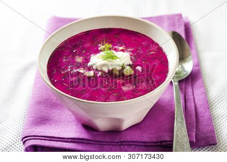 Svekolnik - Traditional Russian Cold Beetroot Soup With Cucumber, Boiled Eggs And Greens In White Bo