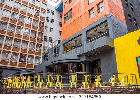 Johannesburg / South Africa - November 19 2016: Colorful Painted Buildings And A Cafe Front In Braam