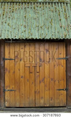 The Wooden, Massive, Double-leaf Hinged Doors In Natural Light