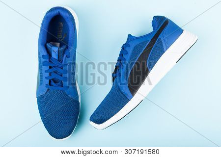Varna , Bulgaria - April 24, 2019: Puma St Trainer Evo Knit Sport Shoes On Blue Background. Puma Is 