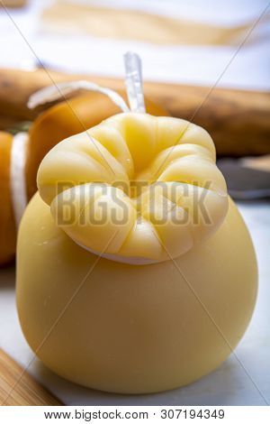 Italian Provolone Or Provola Caciocavallo Hard And Smoked Cheeses In Teardrop Form Served On White M