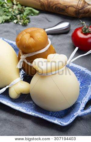 Italian Provolone Caciocavallo Aged And Smoked Cheeses In Teardrop Form Served On Blue Plate Close U