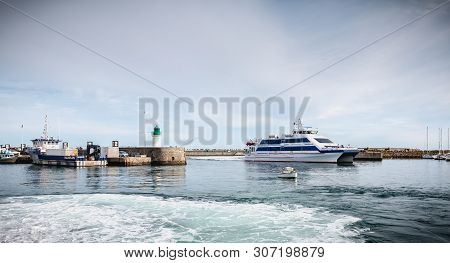 Ferry That Enters The Harbor Of The Island Of Yeu, France