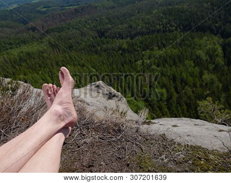 Resting Legs Within Mountain Running Trail. Hiker Watching Hilly Landscape Over Own Hairy Legs.