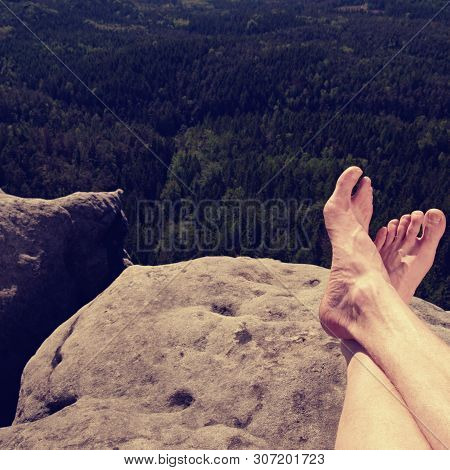 Resting Legs Within Mountain Running Trail. Hiker Watching Hilly Landscape Over Own Hairy Legs.