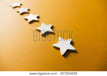 Five White Stars On An Orange Background