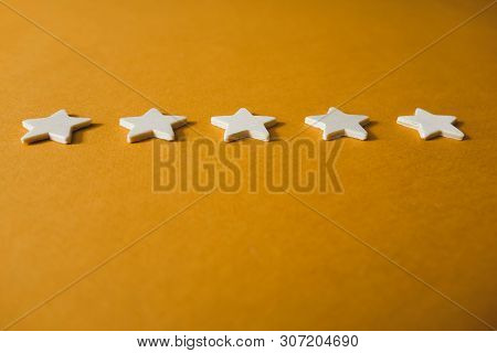 Five White Stars On An Orange Background