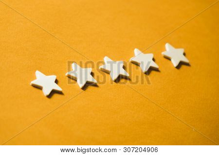 Five White Stars On An Orange Background