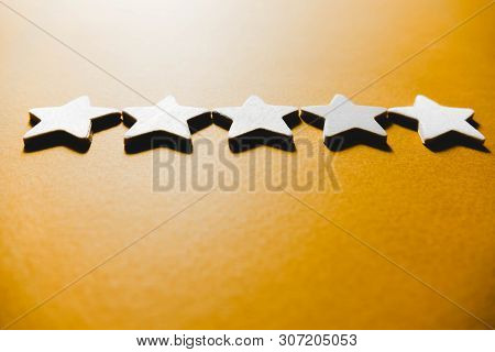 Five White Stars On An Orange Background