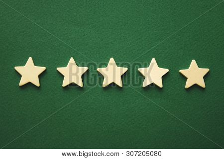 Five White Stars On A Green Background