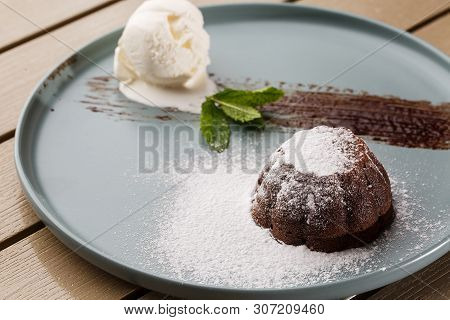 Delicious Fresh Fondant With Hot Chocolate And Ice Cream And Mint Served On Plate. Lava Cake Recipe.