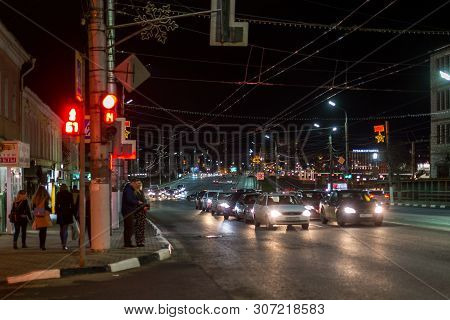 Tula, Russia - April 22, 2017: Dark Night Winter Traffic And Pedestrians On Street Crossroad With Se