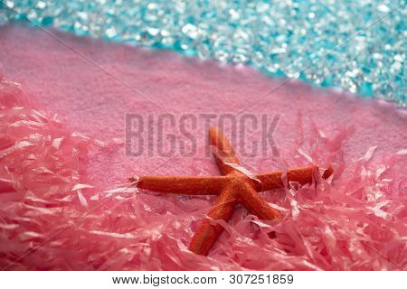 Microplastic pollution in ocean sea concept pink starfish on the beach