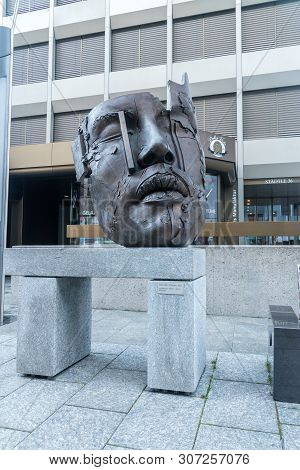 Vaduz, Liechtenstein - June 1, 2019: Face Sculpture African King Made Of Bronze (2000) By Gunther St