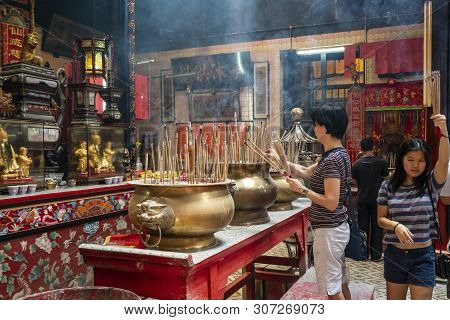 Kuala Lumpur, Malaysia. January 2019.   Believers Pray In Front Of The Altar In Sin Sze Si Ya Temple