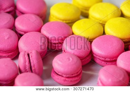Traditional French Dessert Colorful Pink And Yellow Macaroons .