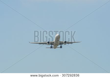 Airplane Landing At The Airport
