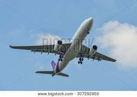 Airplane Landing At The Airport