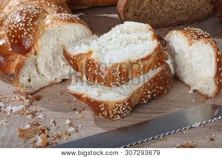 Wicker Bun Slices Close Up With A Knife