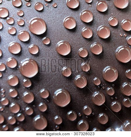 Drops Of Water On The Brown Plastic Texture, Macro