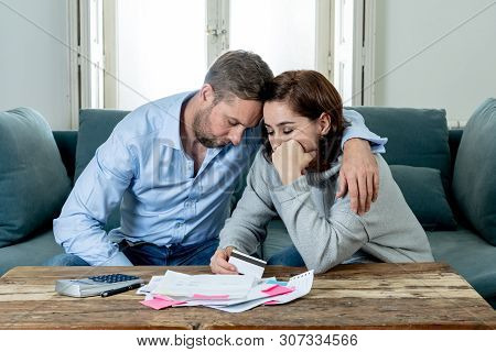 Young Couple Feeling Sad And Stressed Paying Bills Debts Mortgage Having Financial Problems