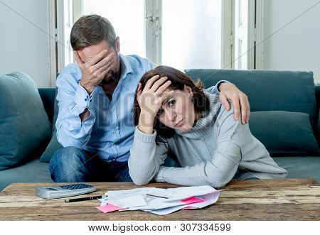 Young Couple Feeling Sad And Stressed Paying Bills Debts Mortgage Having Financial Problems