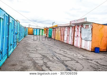 Multicolored Garages In The Industrial Area Witn Asphalt Road