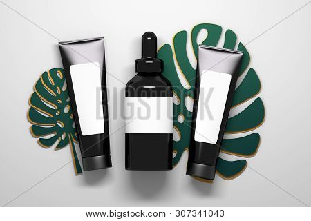 Cosmetics Black Shiny Tubes And Serum Bottle With Liquid Dropper Laying On Large Monstera Plant Leav