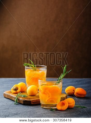 Summer Drinks, Rosemary Aprcot Cocktails With Ice In Glasses. Refreshing Summer Homemade Alcoholic O
