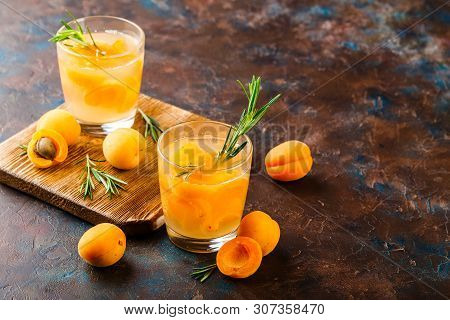 Summer Drinks, Rosemary Aprcot Cocktails With Ice In Glasses. Refreshing Summer Homemade Alcoholic O