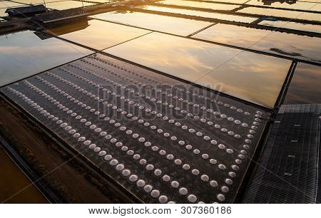 Beautiful Landscape At Sunset Salt Farming. Sea-salt Production In The Country, Sunset In Salt Farmi