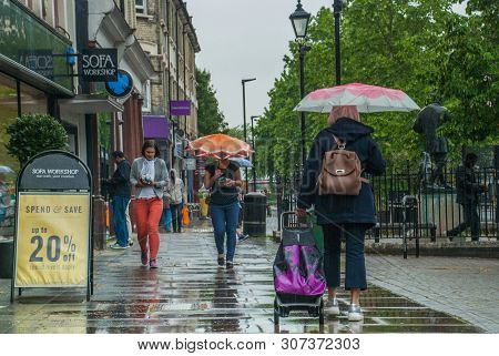 London, Uk - Jun 5, 2019 : Pedestrians Protect Themself From The Rain With Umbrellas During A Rainfa