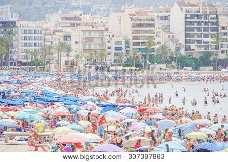 Benidorm, Spain, 16 June, 2019: View Of Benidorm Poniente Beach Full Of Resting People In Benidorm, 