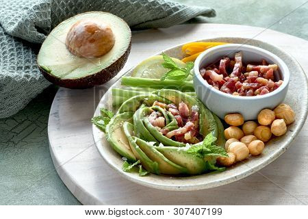 Keto Diet, Close-up On Avocado Rose Salad With Bacon Cubes And Smoked Cheese Seasoned With Lemon, Mi