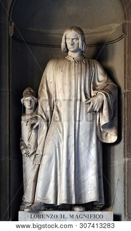 FLORENCE, ITALY - JANUARY 11, 2019: Lorenzo il Magnifico, statue in the Niches of the Uffizi Colonnade in Florence, Italy