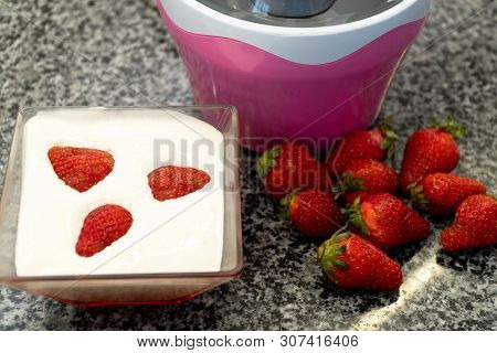 Homemade Strawberries Ice Cream Churning In A Small Ice Cream Machine