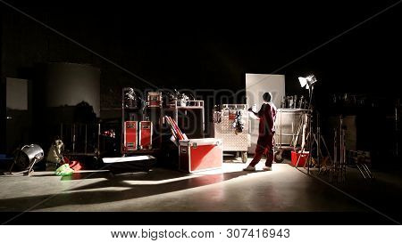 Behind The Shooting Production Crew Team And Silhouette Of Camera And Equipment In Studio.