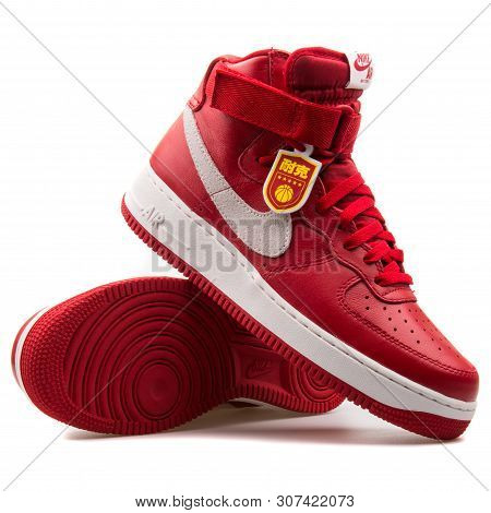 Vienna, Austria - August 25, 2017: Nike Air Force 1 High Retro Qs Red And White Sneaker On White Bac