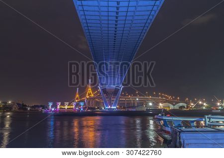 Bhumibol Bridge, Chao Phraya River Bridge. Turn On The Lights In Many Colors At Night.
