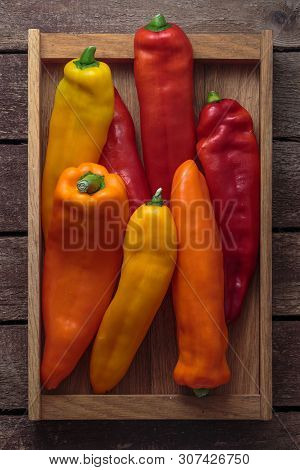 Ripe Colorful Ramiro Peppers On Wooden Background