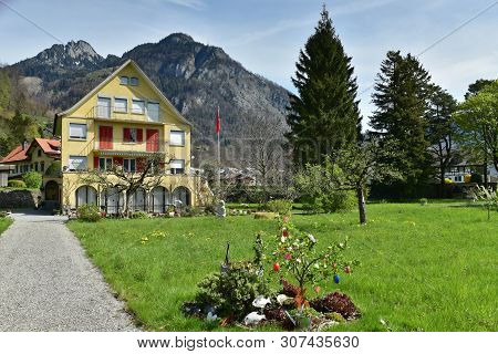 Weesen, Switzerland - April 16, 2019. Beautiful House Decorated For The Easter Celebration On The Ba