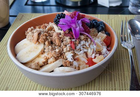 Bowl Of Granola And Fruit Beakfast Food Still Life.  Bowl Has Granola Cereal, Sliced Bananas, Nuts, 