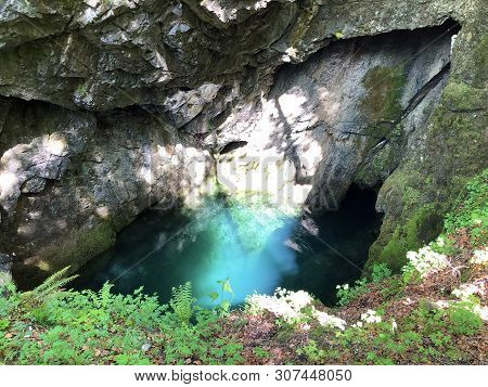 The Cave And The Source Hundsloch By The Alpine Lake Wagitalersee Or Waegitalersee, Innerthal - Cant