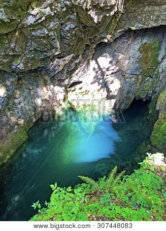 The Cave And The Source Hundsloch By The Alpine Lake Wagitalersee Or Waegitalersee, Innerthal - Cant