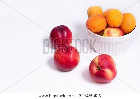 Group Of Whole Nectarine And Apricots Fruit Isolated On White Background