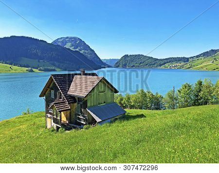 Traditional Architecture And Farmhouse In The Valley Of Wagital Or Waegital And By The Alpine Lake W