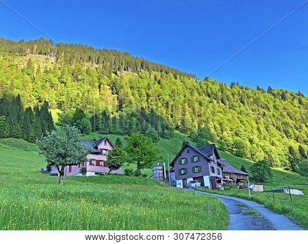 Traditional Architecture And Farmhouse In The Valley Of Wagital Or Waegital And By The Alpine Lake W